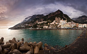 Dramatic coastal town on steep cliffs overlooking turquoise sea