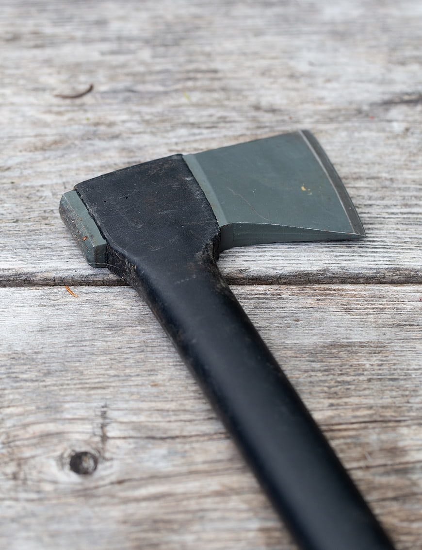 Rusty Hatchet on Weathered Wooden Planks
