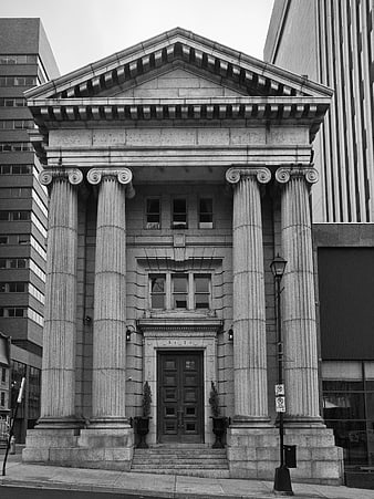Black and white photo of classical stone building facade with columns