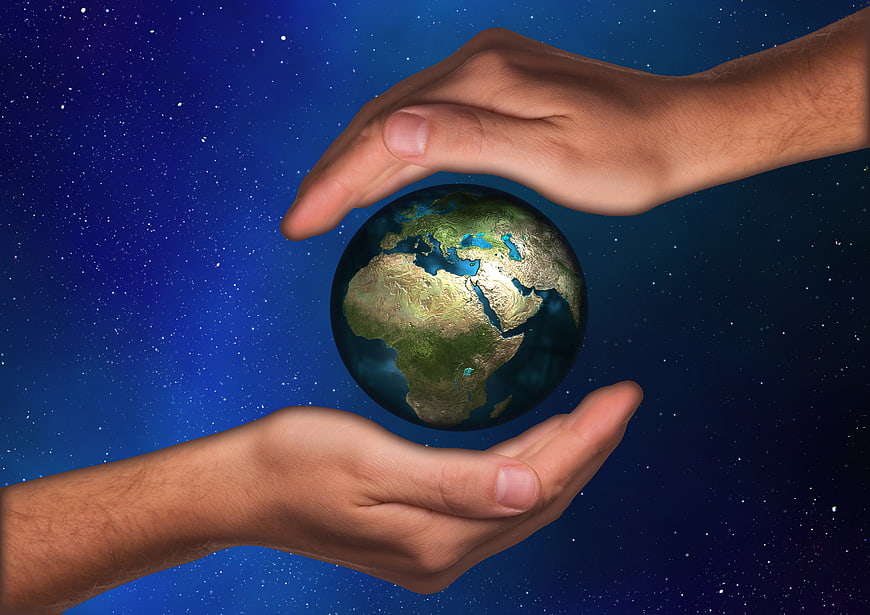 Hands Protecting Earth Globe Against Starry Night Sky Background