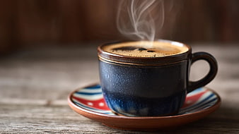 Steaming Hot Coffee in Rustic Ceramic Cup on Wooden Table