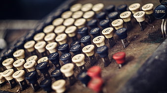 Close-up of vintage cash register keys with numbers