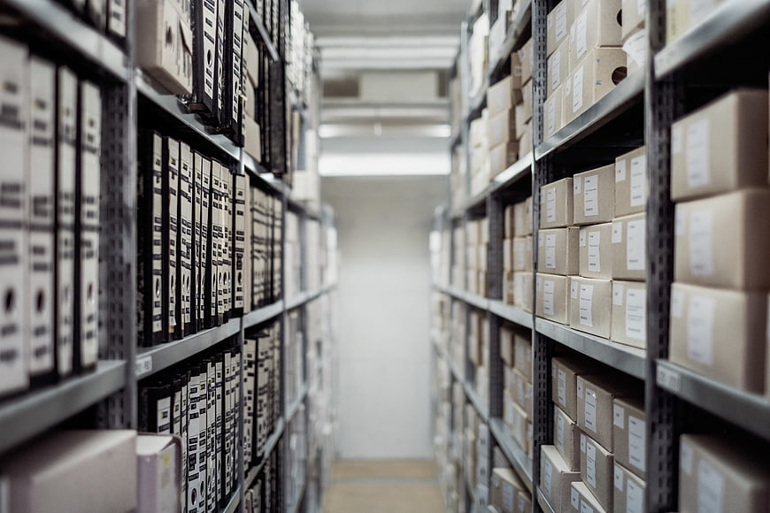 Warehouse Archive Aisle with Filing Boxes and Storage Shelves