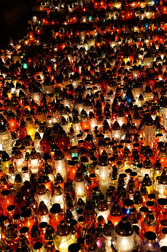 Thousands of Lit Candles in Glass Jars at Night