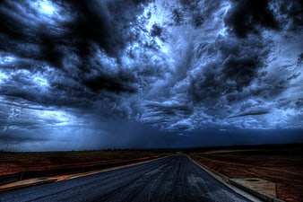 Dramatic Storm Clouds Over Empty Asphalt Road