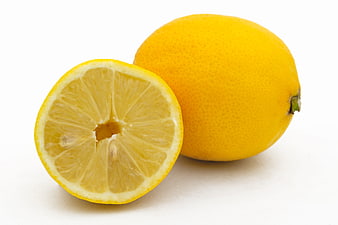 Fresh Whole and Halved Lemon on White Background