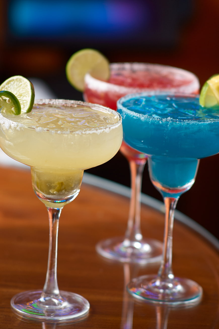 Colorful Margaritas with Salt Rim and Lime Garnish