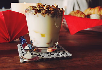 Yogurt Parfait with Granola and Walnuts on Wooden Table