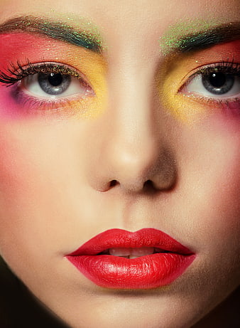 Close-up of Woman with Vibrant Multicolor Glitter Makeup