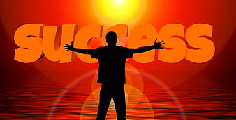 Silhouette of person with arms raised against success text background