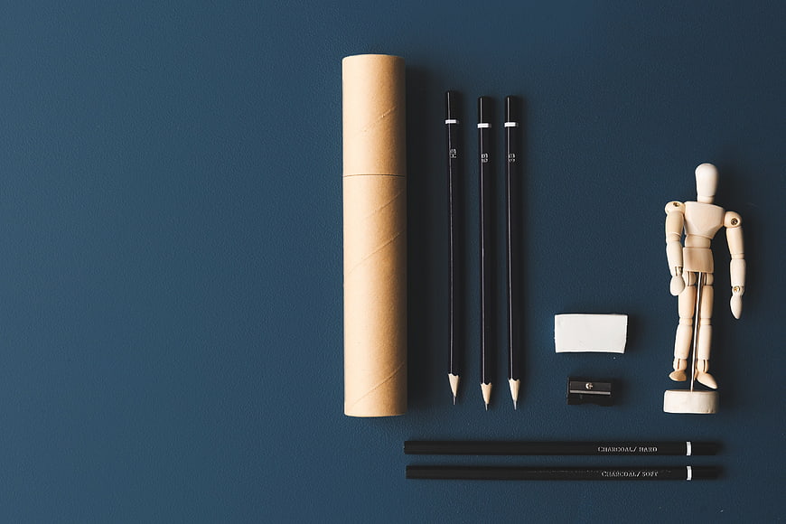 Flat Lay of Art Supplies on Blue Background with Copyspace
