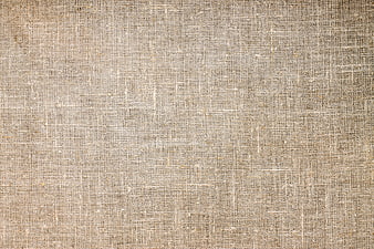 Close-up texture of beige woven burlap fabric background