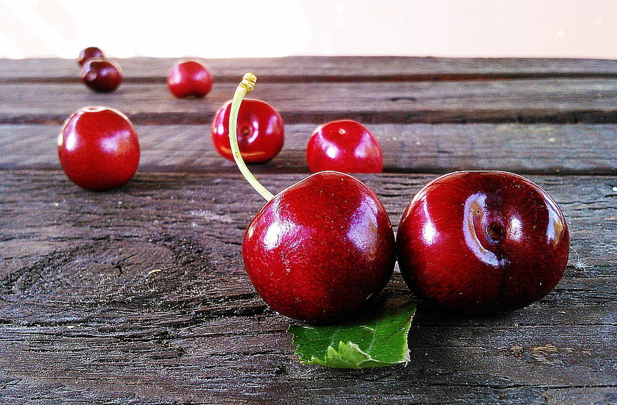 Fresh Red Cherries on Rustic Wooden Table