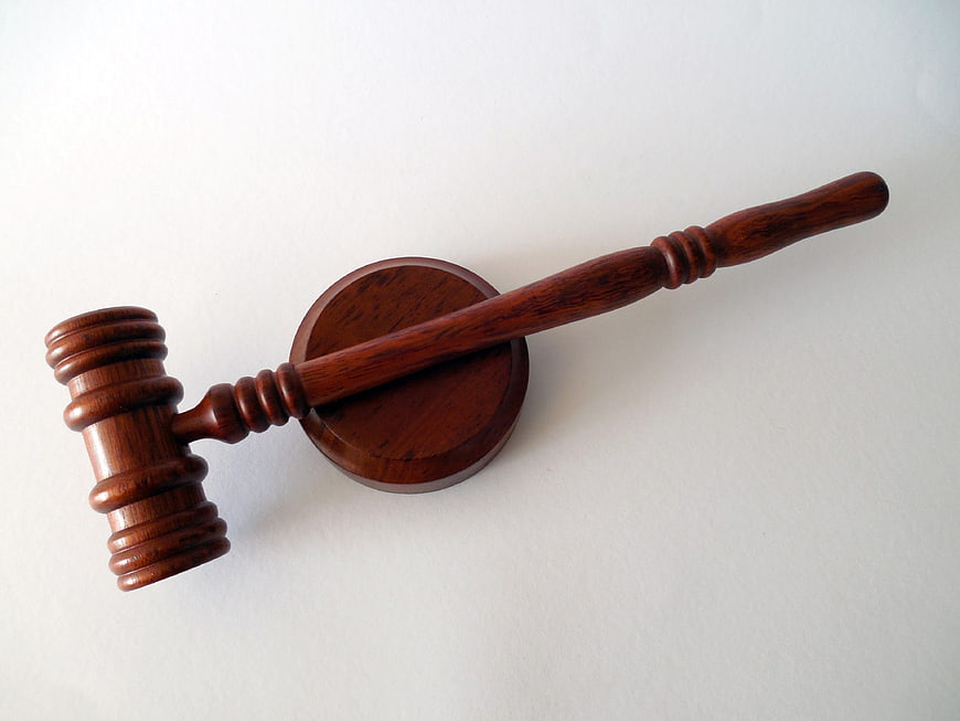 Wooden Judge Gavel and Sound Block on White Background