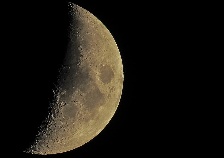 Detailed Crescent Moon Phase Against Black Night Sky