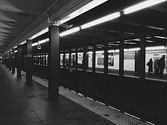 Black and white photo of Fulton Street subway station platform
