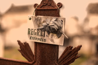 Rusty Cemetery Cross with Regrets Eternels Sign