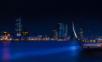 Rotterdam Skyline at Night with Erasmus Bridge and Starry Sky