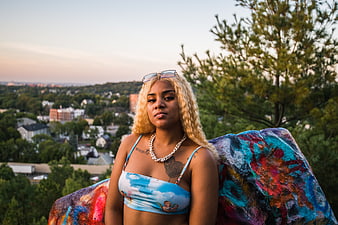 Portrait of Woman with Blonde Hair on Painted Rock