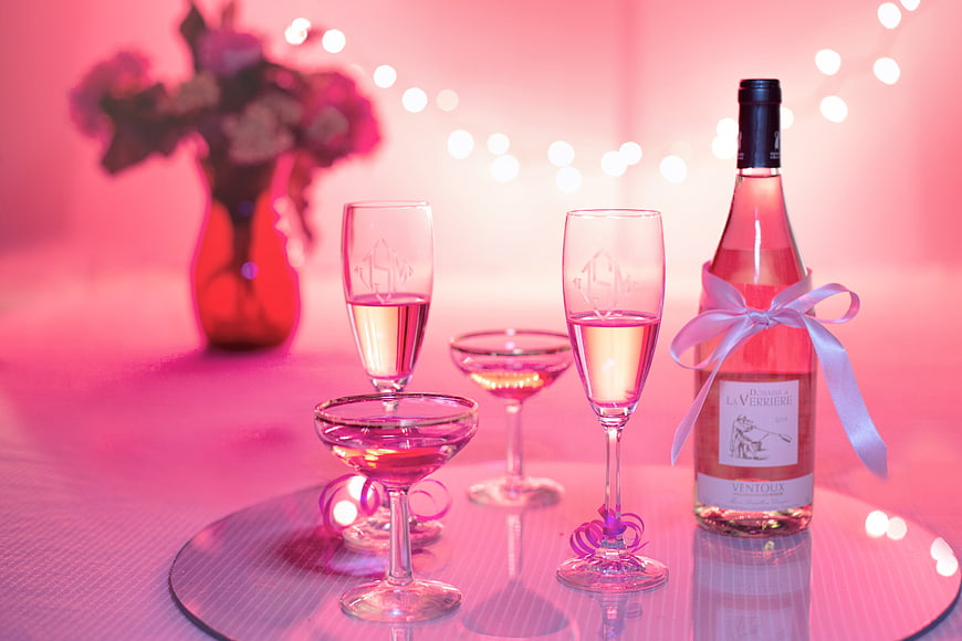 Pink Rosé Wine Bottle and Glasses on Pink Table