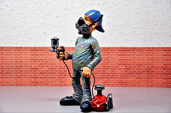 Painted Sculpture of Painter with Spray Gun and Mask
