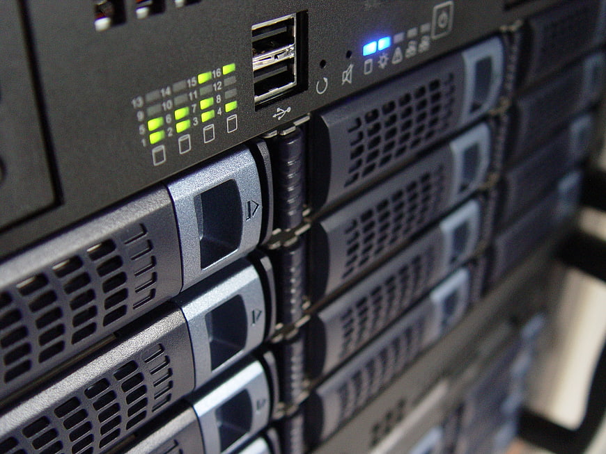 Close-up of server rack with hard drive bays and status lights