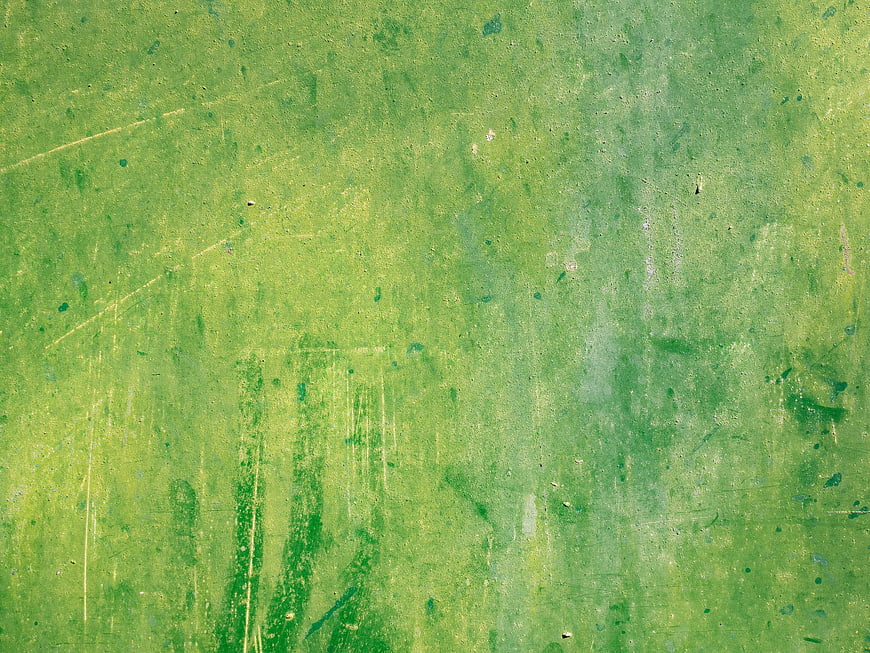 Textured Green Grunge Background with Scratches and Wear