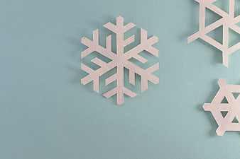 Minimalist Paper Snowflakes on Blue Background