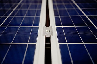 Close-up of solar panel cells and metal mounting bracket