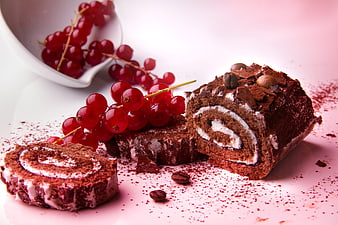 Chocolate Swiss Roll with Red Currants and Cocoa Powder