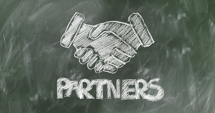 Handshake and Partners Text Chalkboard Drawing