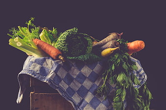 Fresh rustic vegetables on checkered cloth still life