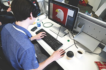 Graphic Designer Working on Computer in Modern Office