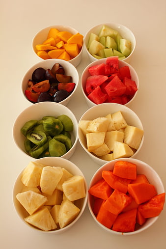 Assorted Fresh Cut Fruits in White Bowls