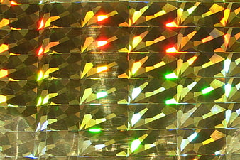 Abstract gold foil texture with multicolor iridescent reflections