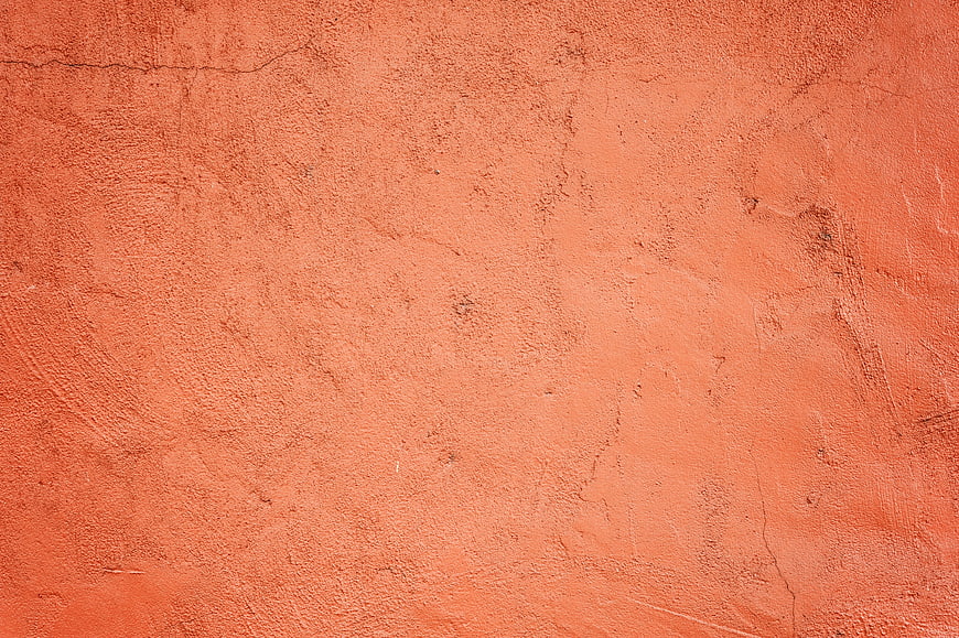 Textured Orange Plaster Wall Surface Background