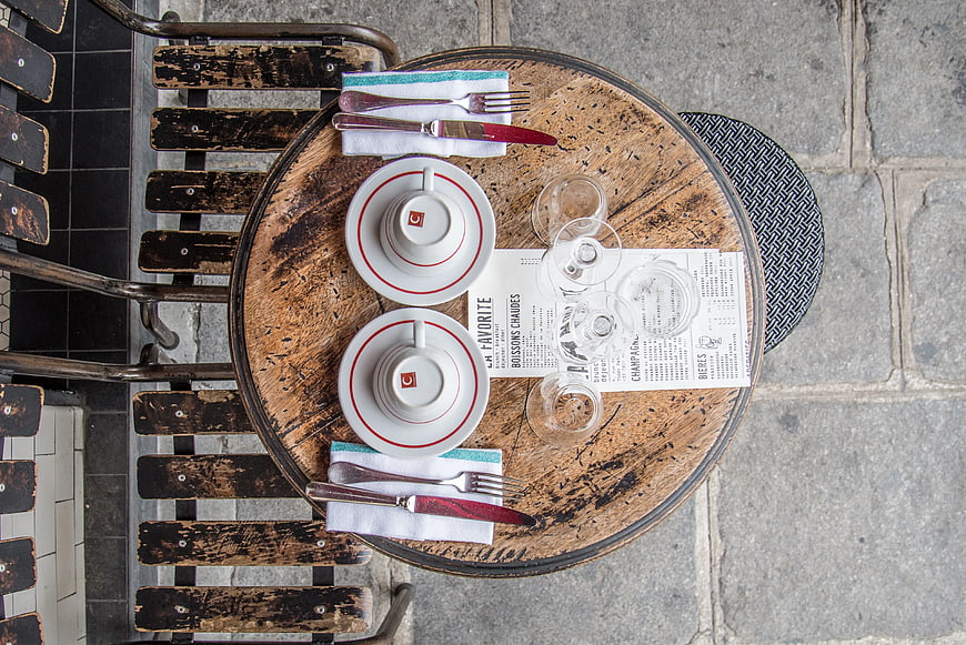 Top View of Outdoor Cafe Table Setting with Coffee Cups