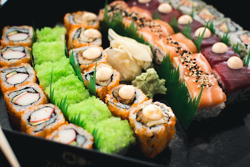 Assorted sushi platter with salmon, tuna, and rolls