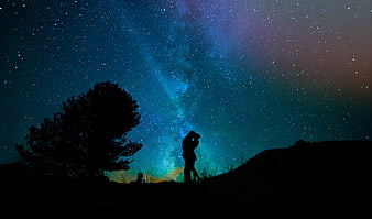 Silhouette of Couple Under Milky Way Starry Night Sky