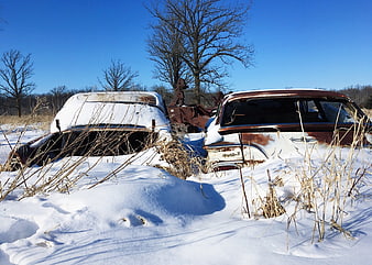 Abandoned Rusty Cars Buried in Snow Winter Landscape