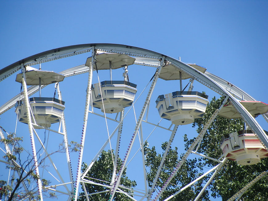 White Ferris Wheel Against Clear Blue Sky