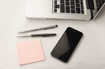 Minimalist Workspace Flat Lay With Laptop, Smartphone, Pens, And Sticky Notes