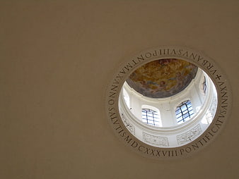 Looking up at the painted dome ceiling of a Roman church