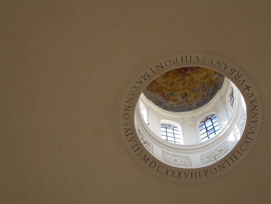 Looking up at the painted dome ceiling of a Roman church