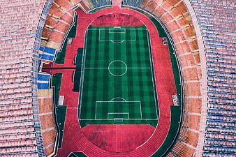 Aerial View of Empty Soccer Stadium with Green Pitch
