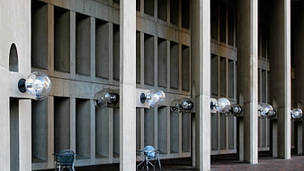 Modernist concrete architecture with spherical lights and pillars