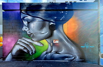 Colorful Street Art Mural of Woman Eating Apple