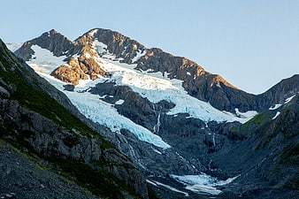 Majestic Glacier and Snow-Capped Mountain Peak in Alaska