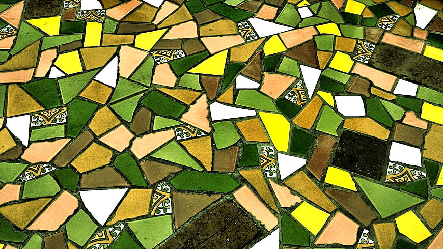 Close-up colorful mosaic floor texture pattern with green and yellow tiles