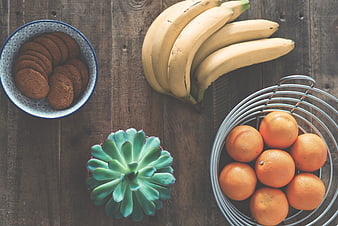 Top View of Healthy Snacks with Fruit and Cookies on Wood